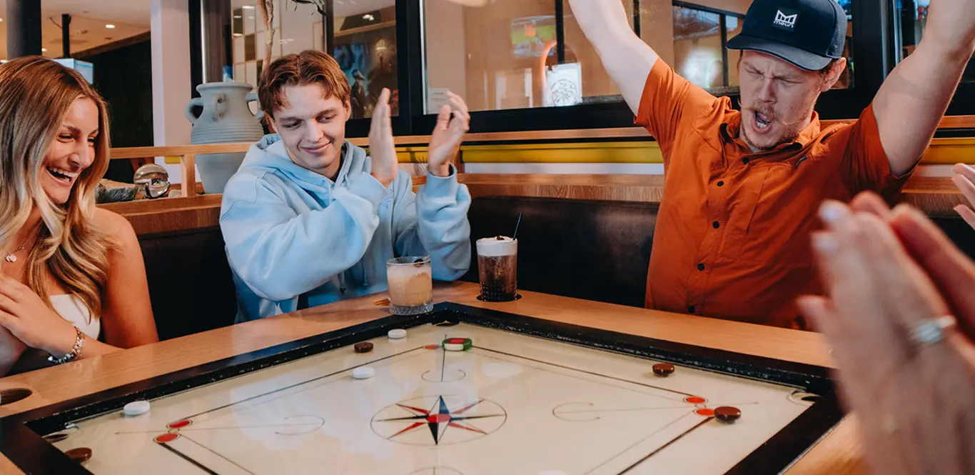 A group celebrating at a House Rules event