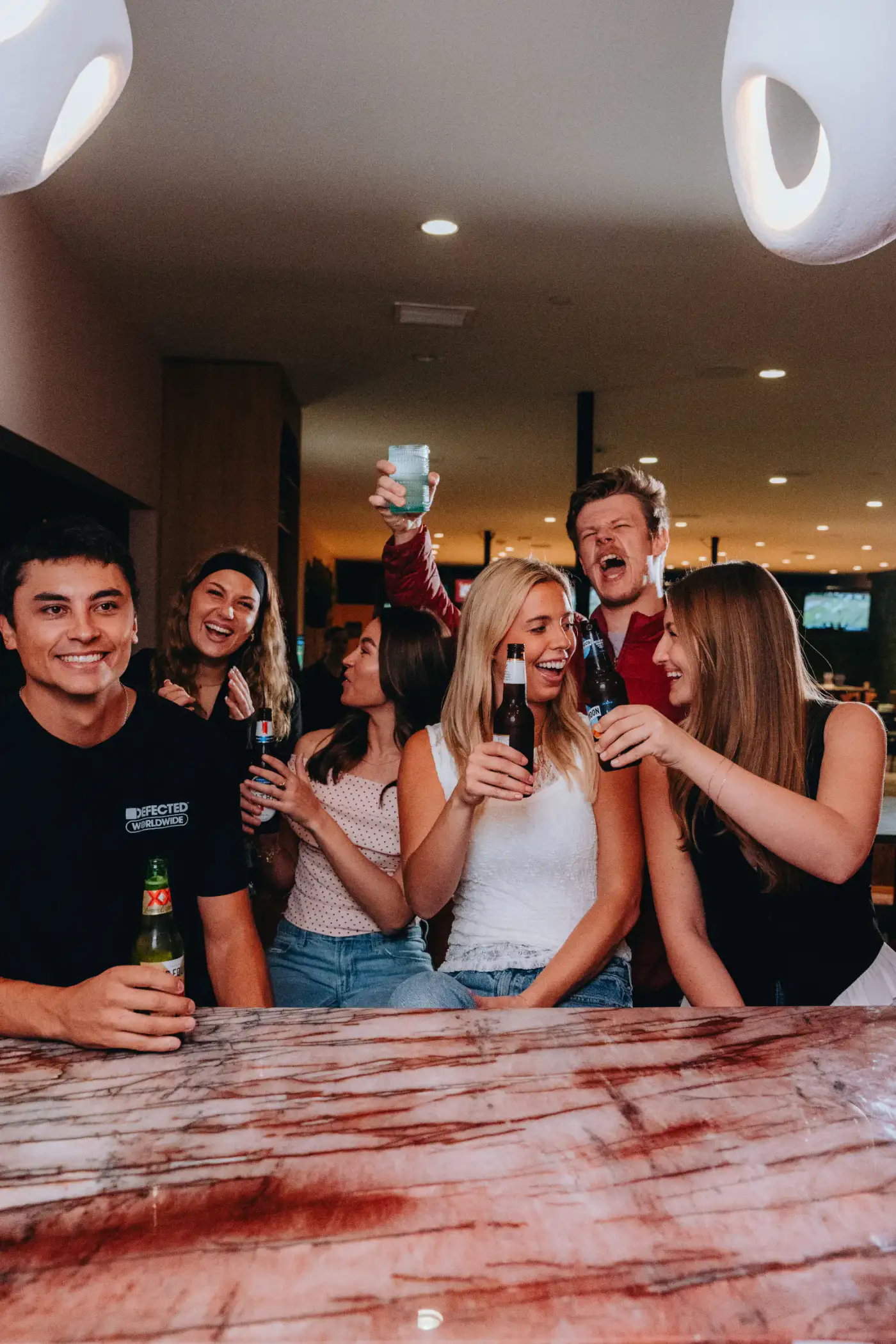 Friends raising a toast at House Rules Scottsdale